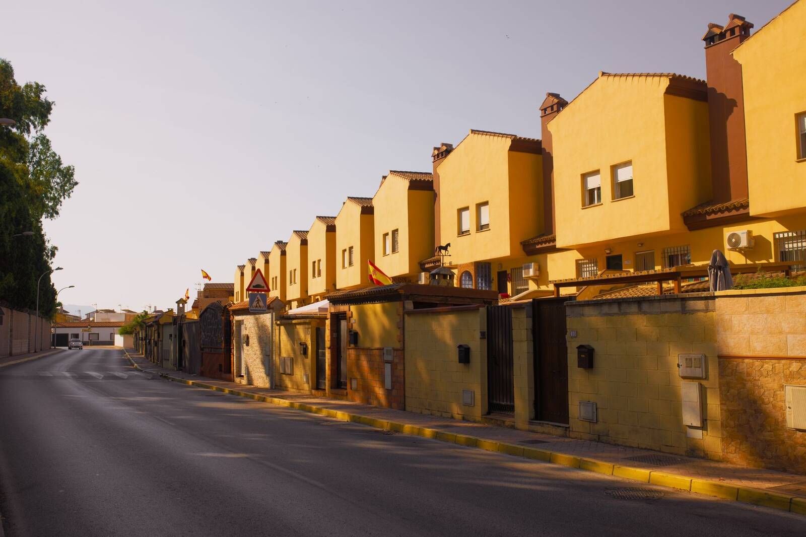 Row of adobe-toned houses along a quiet street