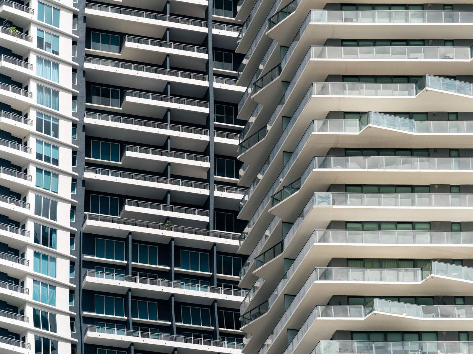 Curved residential tower with stacked balconies