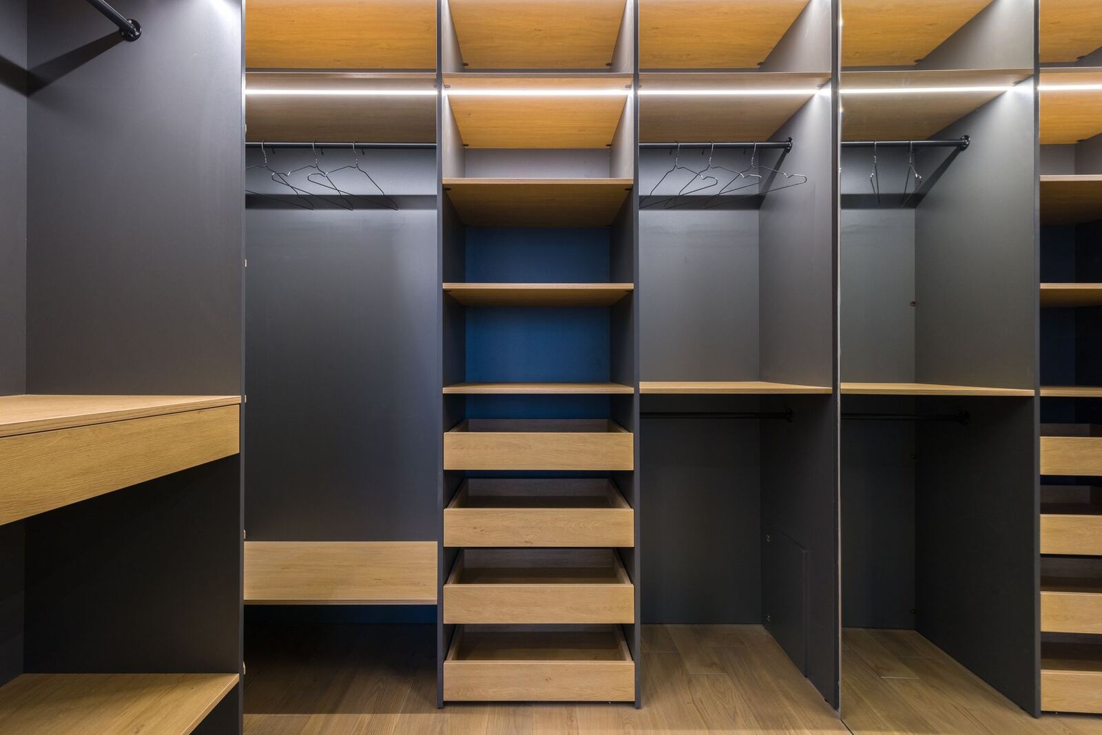 Empty built-in closet shelving and drawer bank