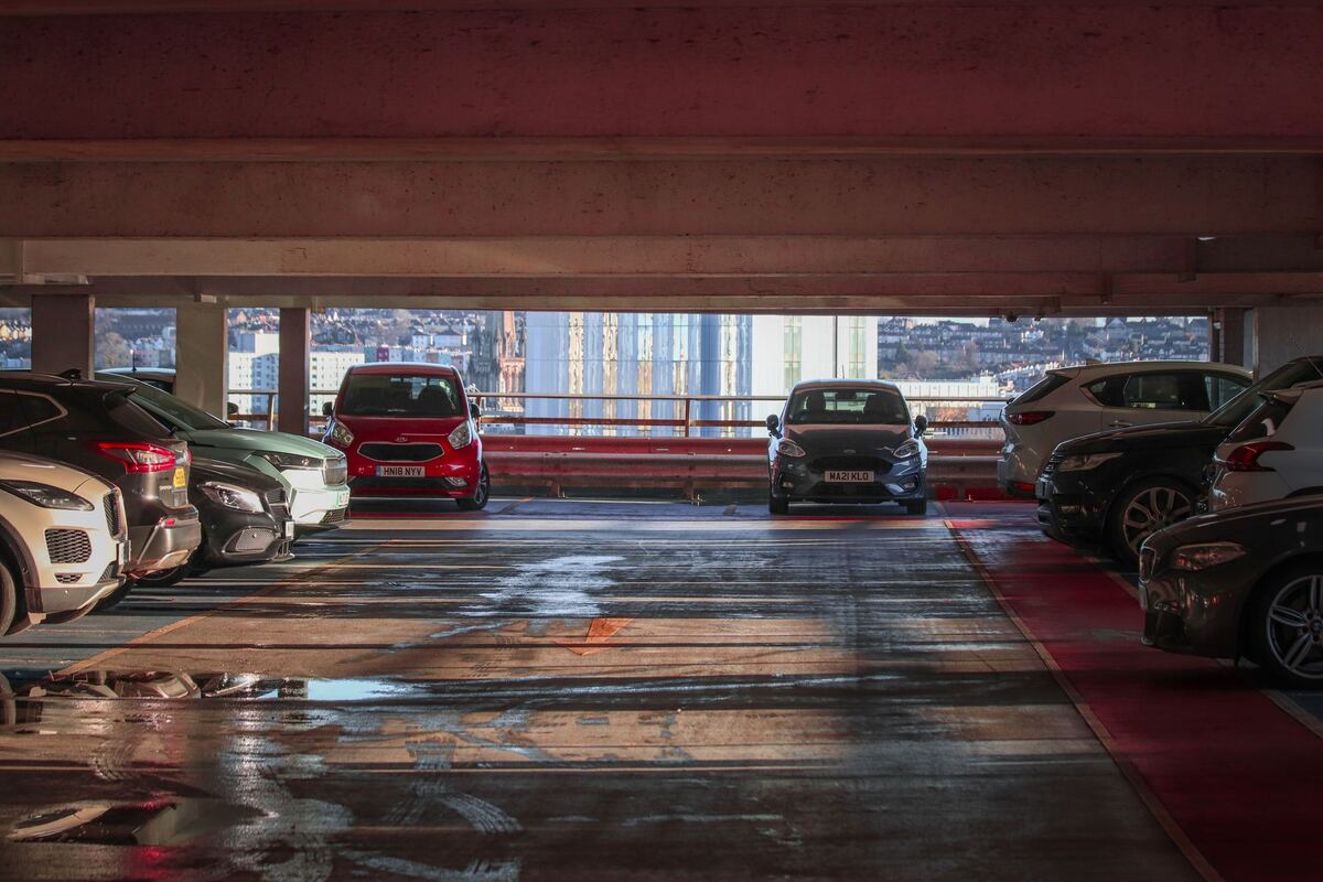 Cars parked on a level of a structured parking garage